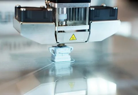 Head of industrial 3d printer in action. Stock Photos