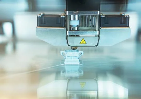Head of industrial 3d printer in action. Stock Photos