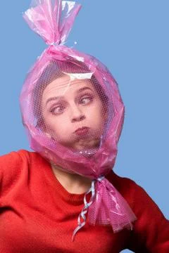 Head inside candy wrapper Stock Photos