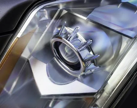 Head light of a ten year old car Stock Photos