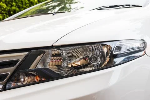 Head light of white car. Stock-Fotos