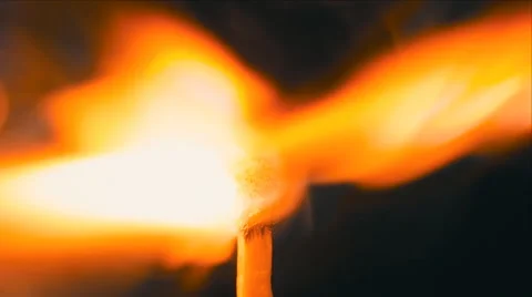 Head matches is lit a bright flame. Macro Stock Footage 61550994