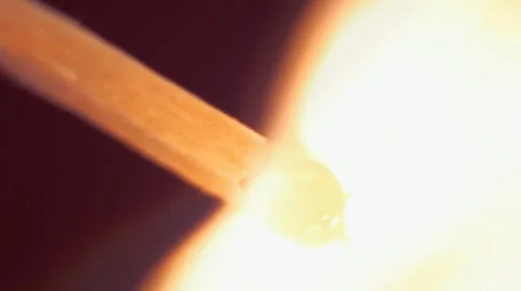 Head matches is lit a bright flame. Macro Stock Footage 61551088