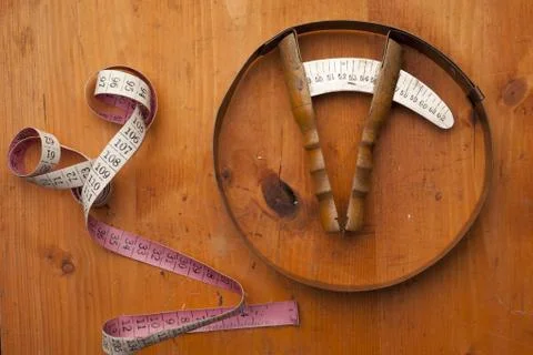 Head meter hatmaker tools craft concept on wooden texture Stock Photos