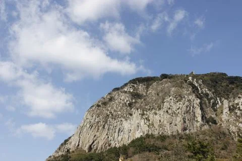 Head of mountain with cloudy blue sky Stock Photos