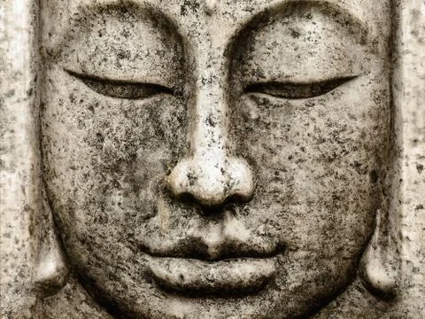 Head of an old buddha statue Stock Photos