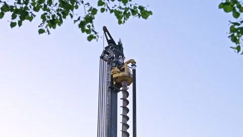 Head of Pile Driver Machine Drill at Building Construction Site or Oil Drilling Stock Footage 276237597