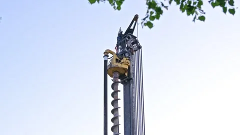 Head of Pile Driver Machine Drill at Building Construction Site or Oil Drilling Stock Footage 276237617