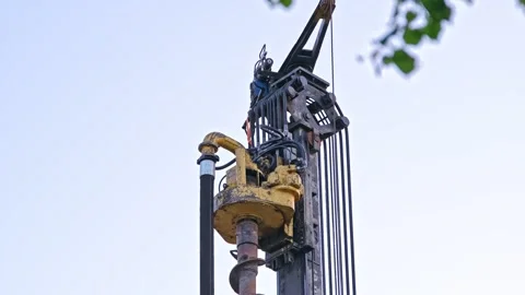Head of Pile Driver Machine Drill at Building Construction Site or Oil Drilling Stock Footage 276237644