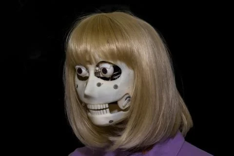 The head of the robot of the android on a black background Stock Photos