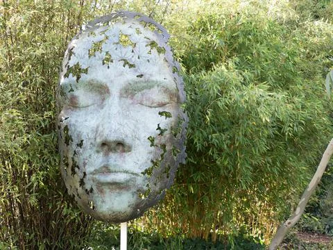 Head sculpture 'Leaf Spirit' by sculptor Simon Gudgeon on show in Dorset.Bronze Stock Photos