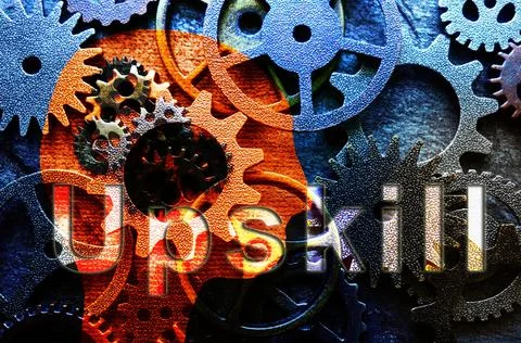 Head shape with assorted metal machine gears and Upskill text Stock Photos