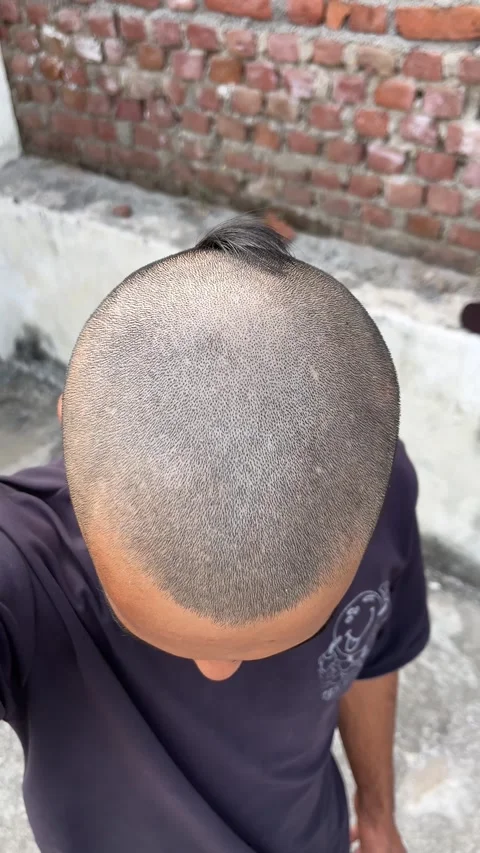 Head-Shaved Boy Showing His Newly Bald Look 스톡 동영상 321945202