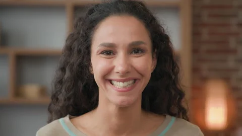 Head shot close up front view at home indoors happy cheerful female face smiling Stock Footage 209620339