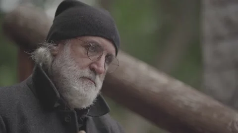 Head shot close up of an old man sitting and thinking slog2 Stock Footage 141878364