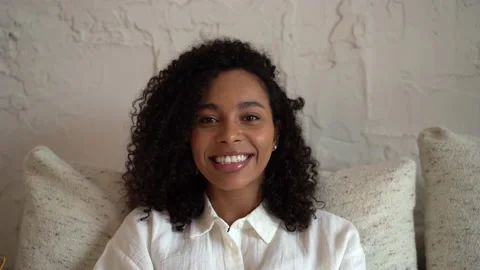 Head shot close up young smiling mixed race beautiful woman looking at camera Stock Footage 157452815