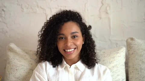 Head shot close up young smiling mixed race beautiful woman looking at camera Stock Footage 157452855