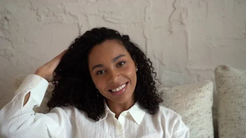 Head shot close up young smiling mixed race beautiful woman looking at camera Stock Footage 157452922