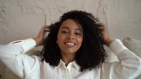 Head shot close up young smiling mixed race beautiful woman looking at camera Stock Footage 157453213