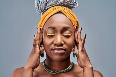 Head shot portrait afro american attractive calm woman isolated on grey backg Stock Photos