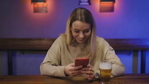 Head shot smiling pretty millennial 20s girl holding smartphone in hands Stock Footage 151265899