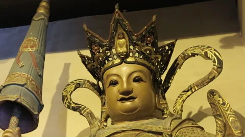 Head of the statue at the Buddhist temple Stock Footage 44421715
