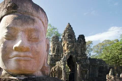 Head of statue at gate to Angkor Thom Stock Photos