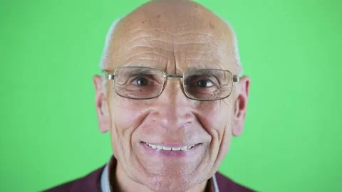 Head studio shot of senior man wrinkled face wearing eyeglasses Video stock 164917412