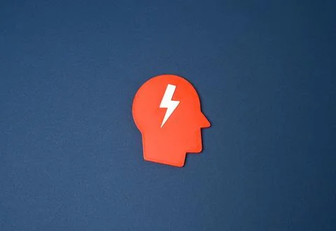 Head symbol with a lightning bolt representing shock. Acute reaction, stress  Stock Photos