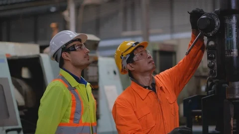 Head of technician man guide and support his staff to fix the machine problem Stock Footage 124617038