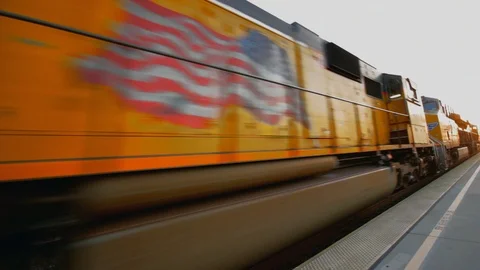 Head of train passes by Burbank Amtrak station Stock Footage 94490688