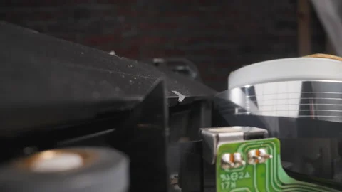 Head turns reading information from tape with moving runner Stock Footage 186429731
