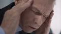 Headache disturbing businessman at meeting, overtime work causes exhaustion HD Footage