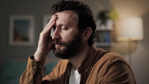 Headache, head pain. Overworked bearded man in glasses with headache. Sad tired 库存影片 196202236