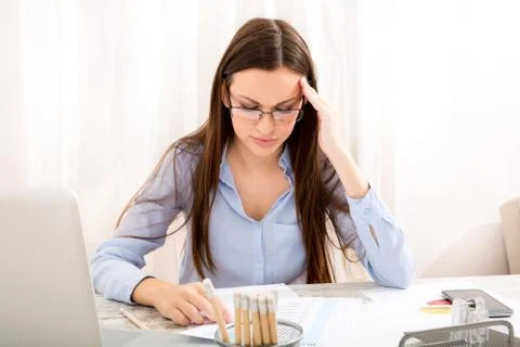 Headache meanwhile working Stock Photos