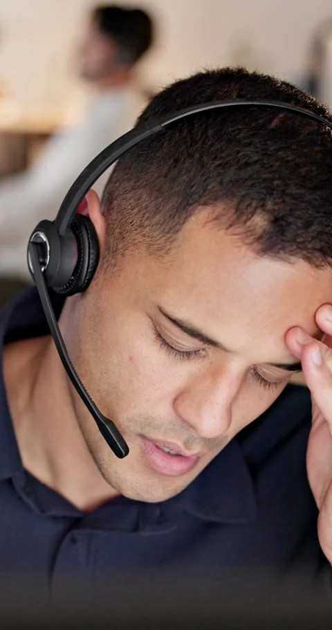 Headache, stress or man with headset in call center, overwhelmed or burnout for Stock Footage 335809427