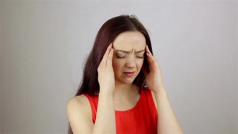 Headache, Stressful Work Overload for a young beautiful woman Stock-Footage 77132978
