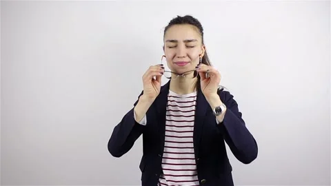 Headache, Stressful Work Overload for a young beautiful woman with glasses. A Stock Footage 101127859