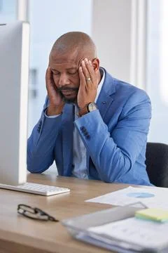 Headache of tired professional man on computer for project deadline, mental Stock Photos