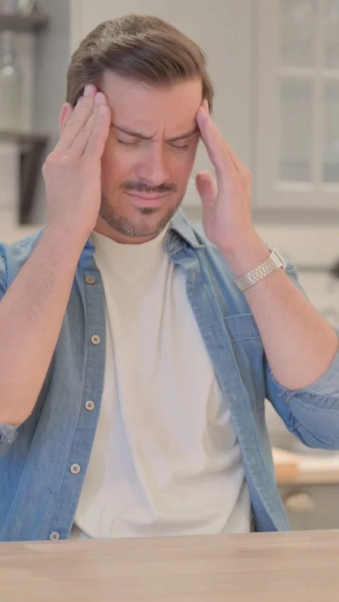 Headache,  Tired Young Man having Pain in Head, vertical video Video stock 328564831