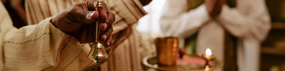 Header of Indian Man Ringing Brass Bell during Traditional Prayer Ceremony Stock Photos