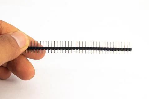 A header module of the jumper is held in hand. This module is used for electr Stock Photos