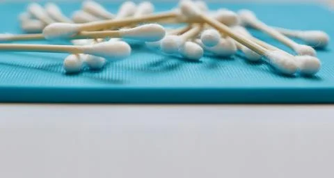 Header panel showing biodegradable bamboo cotton buds on a blue board Stock Photos