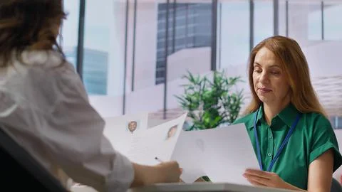 Headhunters team going through selection process by reviewing CVs Stock Photos