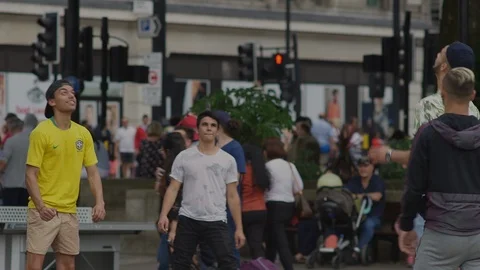 Heading football back and forth Marble Arch, London Stock Footage 93210382