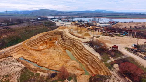 Heading to the large borrow pit for sand extraction. Equipment for mining and Stock Footage 331469731