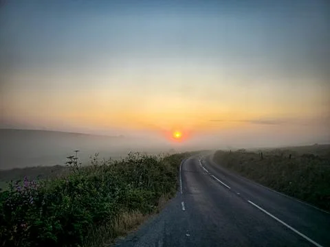 Heading into the mist at sunrise Stock Photos