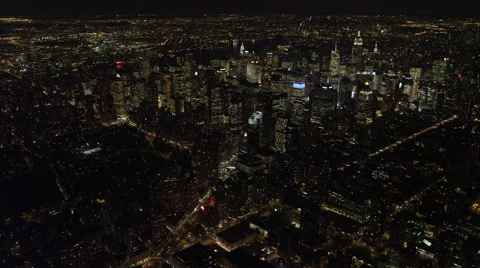 Heading southeast over Manhattan at night toward Times Square, flying over Stock Footage 59171468