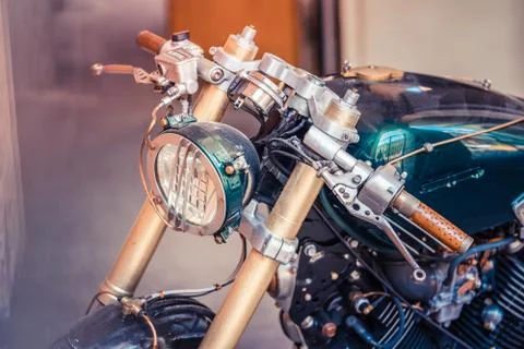 Headlamp of a chopper. In front of chrome elements and chrome engine Stock Photos