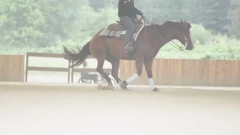 Headless cowboy spin the western horse in slow mov 4K Stock Footage 200000388